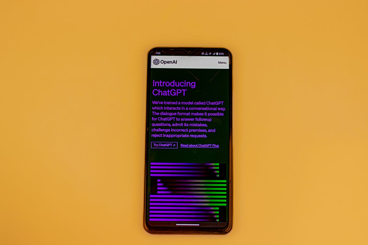 Services-02 Smartphone displaying ChatGPT interface on a vibrant background, showcasing AI technology.